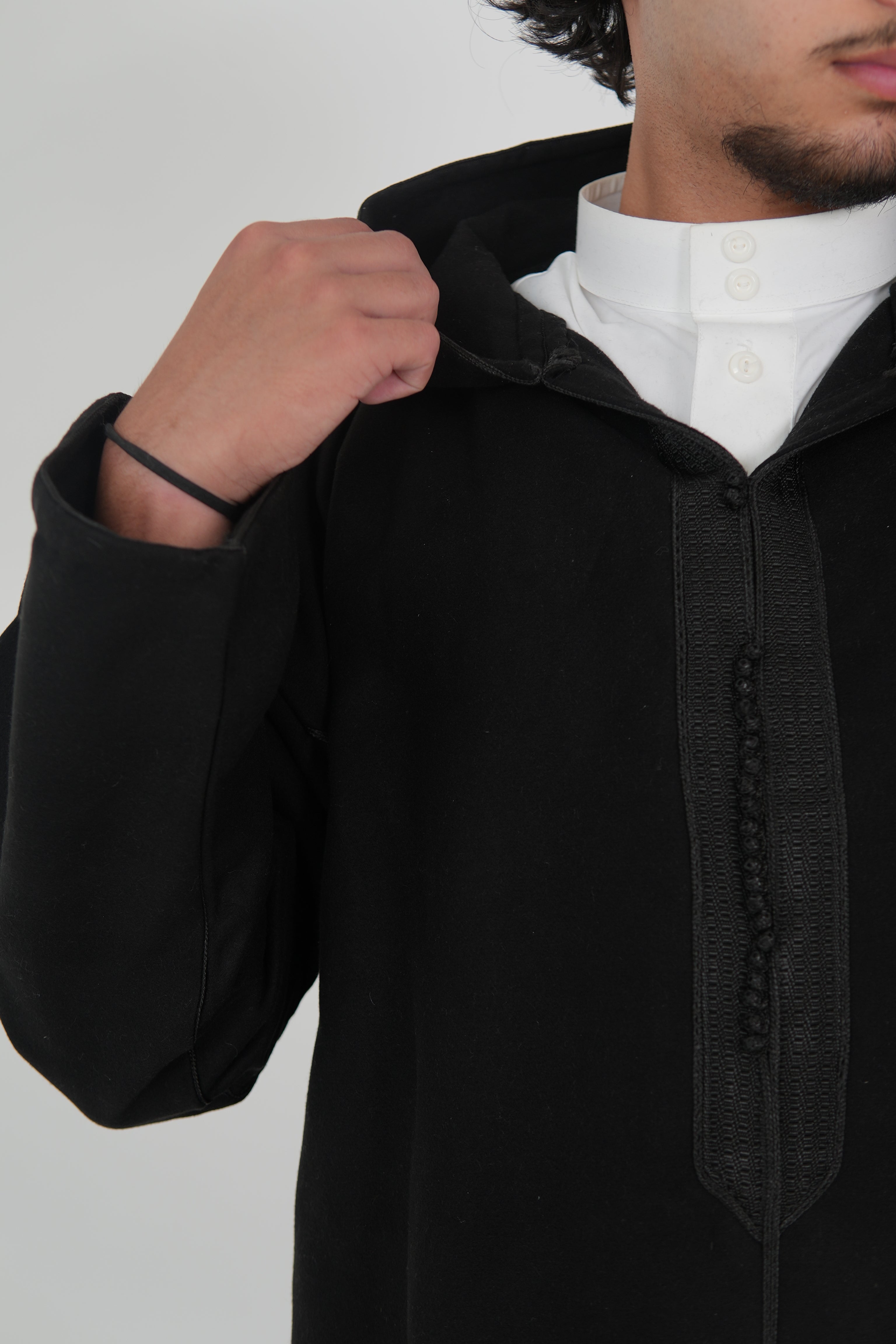 Man wearing a Black Moroccan Djellaba – traditional hooded thobe robe